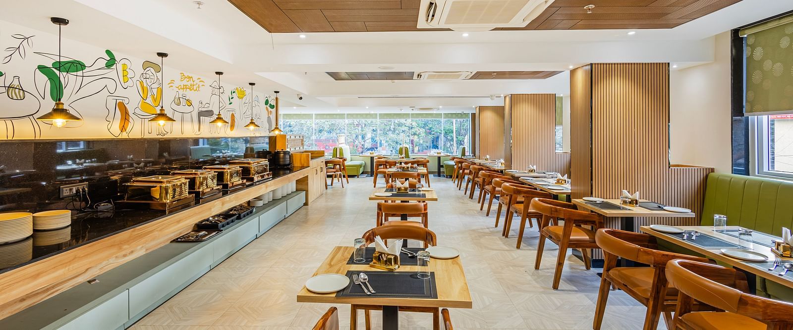 Lemonridge Hotels, KPHB | Dining area with neatly arranged tables and chairs, ready for diners. Clean and bright space.
